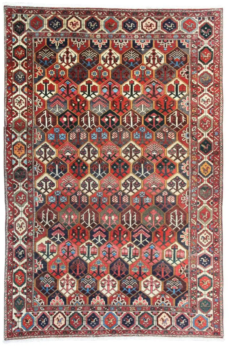 Bakhtiari rug (312x210 cm) with a geometric pattern, shades of red and blue, decorative border