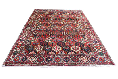 Bakhtiari rug (312x210 cm) laid flat, geometric pattern in red, blue, and beige