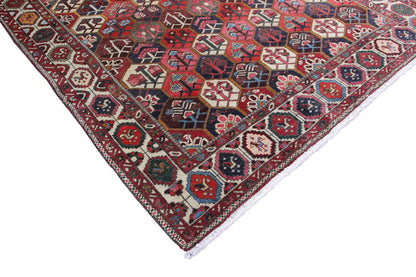 Bakhtiari rug (312x210 cm) detail view: colorful medallions, zigzag and diamond motifs