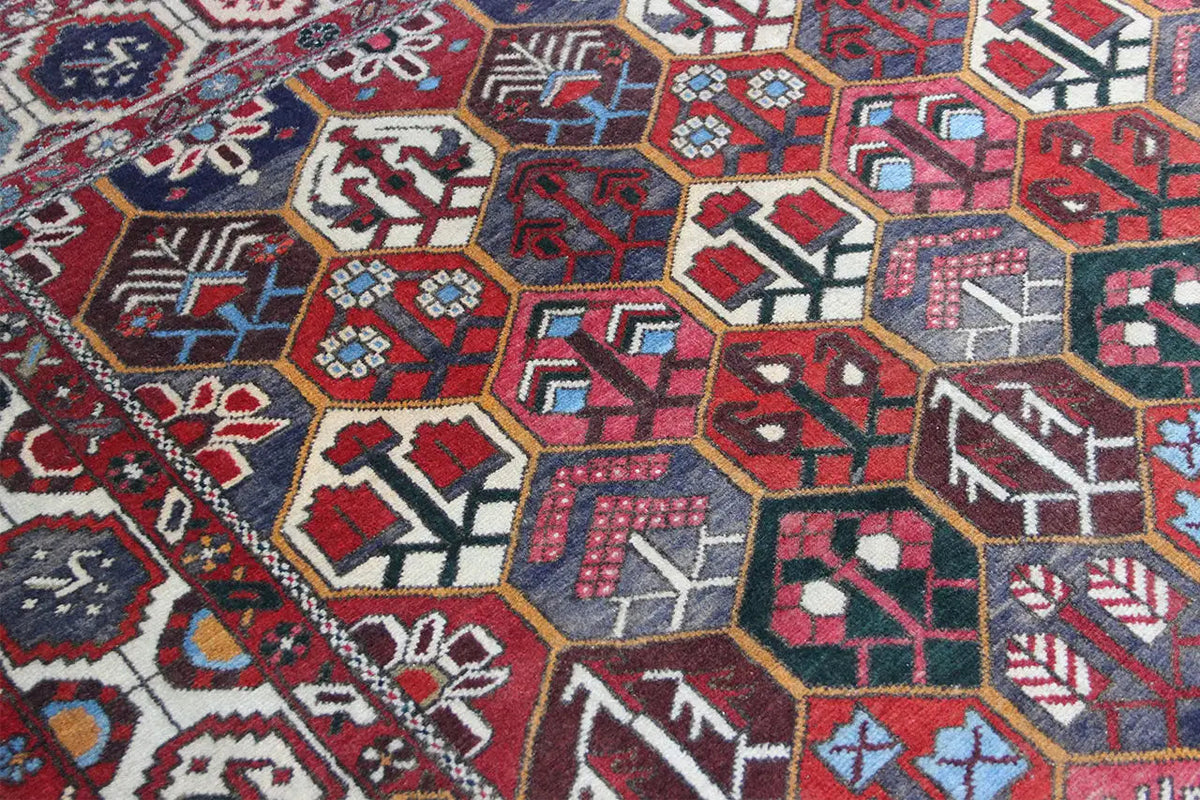 Bakhtiari rug (312x210 cm), pattern detail with hexagon and arrow motifs, red-blue-beige