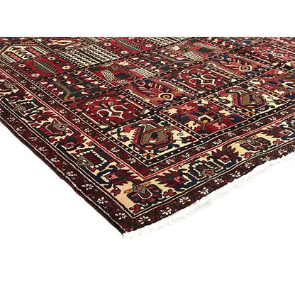 Oriental Bakhtiari rug detail view: colorful medallions, diamonds, and borders in dark red