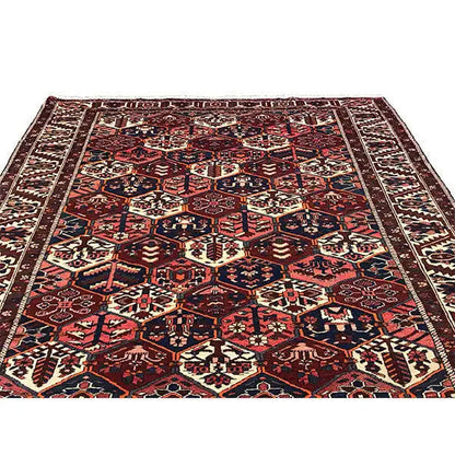 Persian rug with dense geometric ornament, dark red, blue, beige