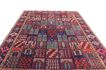 Rectangular oriental rug with a bold patchwork design in red and blue