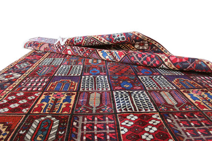 Oriental rug unrolled with a visible relief texture and pattern in red, blue, and white