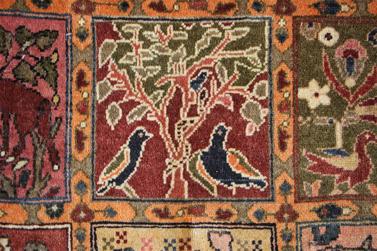 Oriental rug with ornate medallions and birds in red, beige, and blue