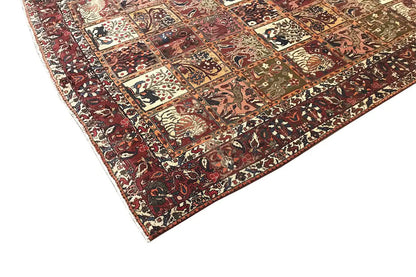 Oriental rug with geometric panels and ornaments in red, cream, and dark green