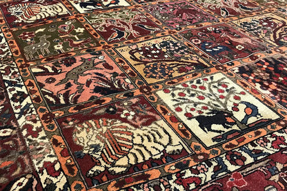 Close-up: Oriental rug details with animal motifs, vines, and decorative border in red and blue