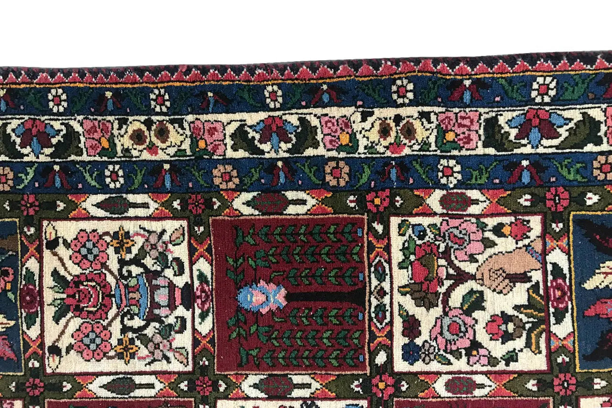 Oriental rug with a multicolored tile pattern and fringe along the edge.