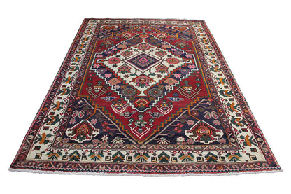 Oriental rug, lying flat, red ground motif with a blue border and ornamental friezes
