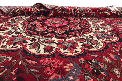 Rug surface with a large red medallion and beige/dark blue ornaments.