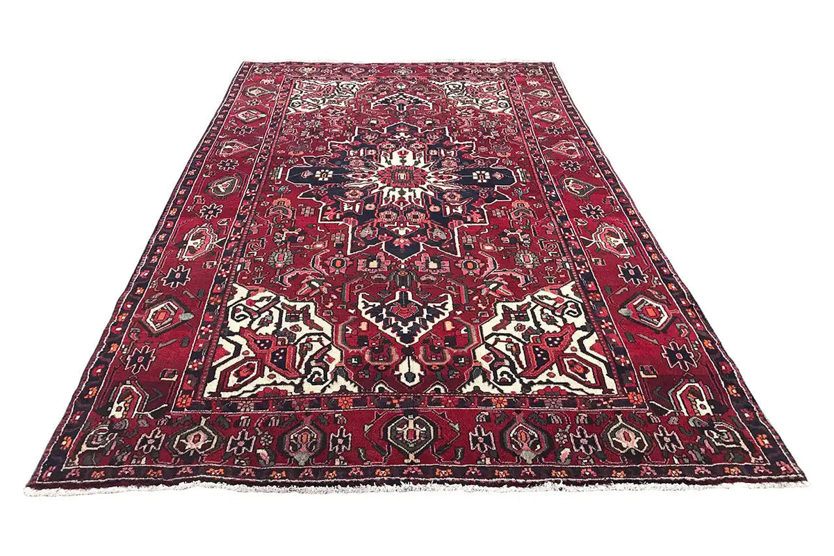 Bakhtiari rug, rectangular, red with a blue border and ornamental white patterns