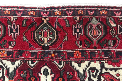Carpet border with repeating ornaments in red, blue and off-white