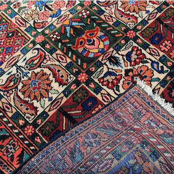 Bakhtiari rug (145x105 cm) close-up: dense ornamental pattern in red, blue, and green