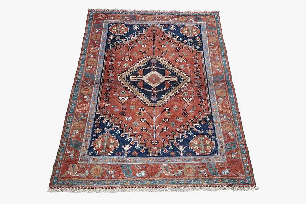 Qashqai rug 3809 with central diamond medallion, blue border and decorative ornaments