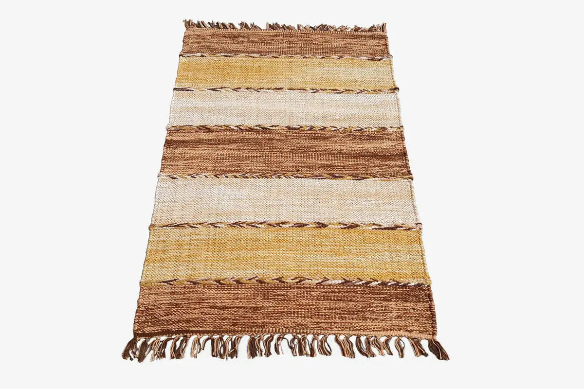 Modern kilim rug with stripes in shades of brown, beige, and yellow, as well as fringes