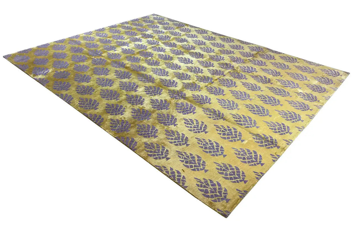 Designer rug with a yellowish-purple pattern, stretched out in a diagonal view