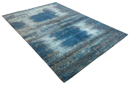 Designer rug, abstract blue-gray pattern, rectangular and laid out at an angle