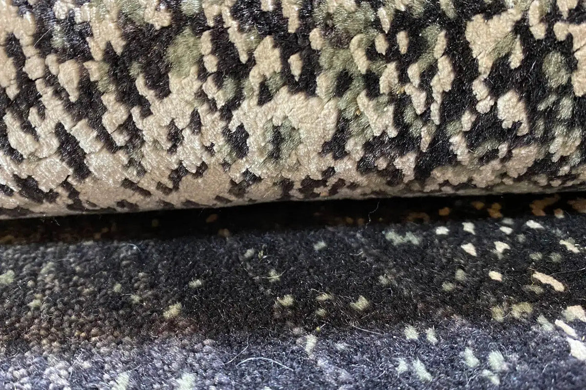 Designer rug 239x179 cm close-up: pile texture with black-gray-white contrasting flecks