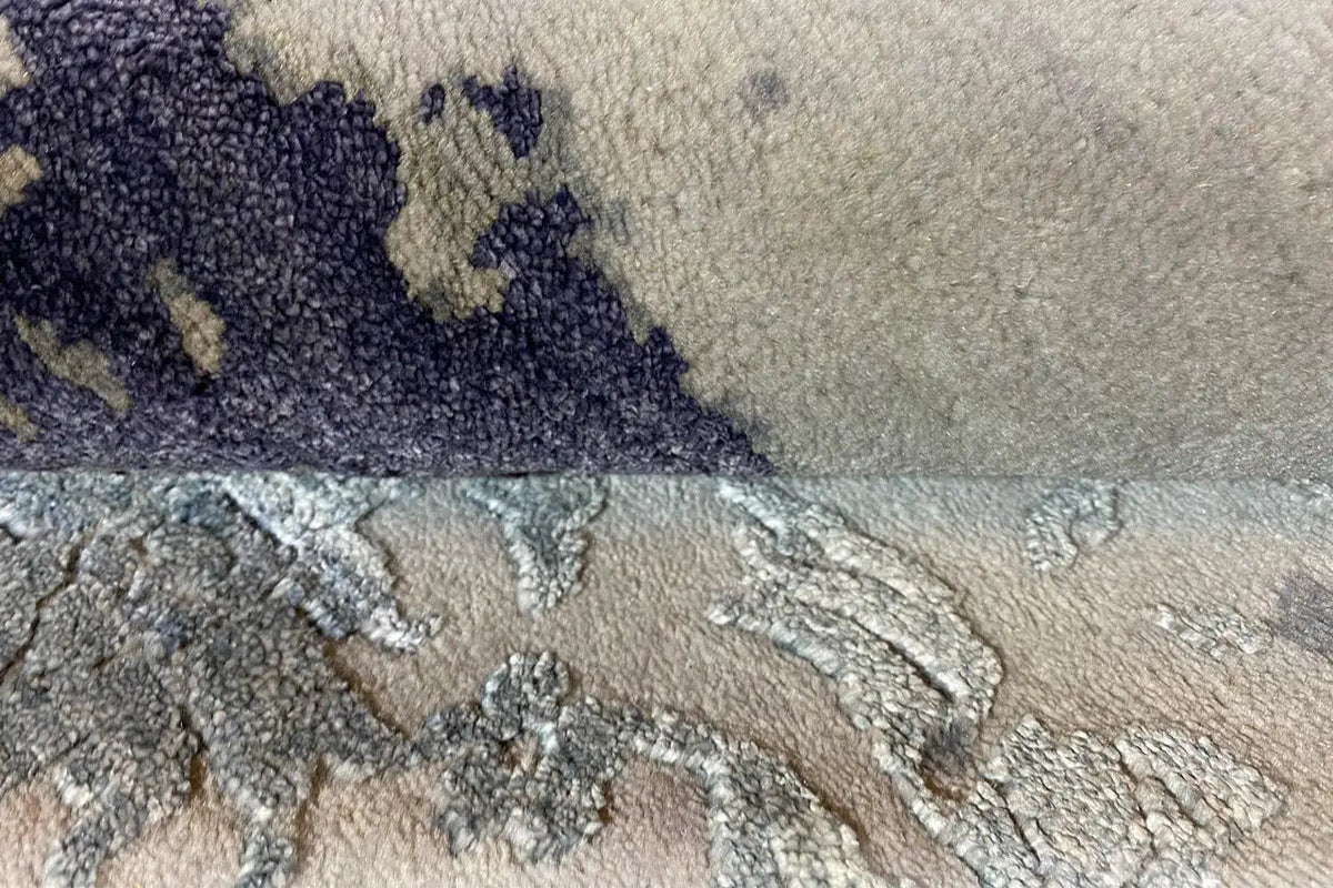 Rug with a textured surface and blue patterned area