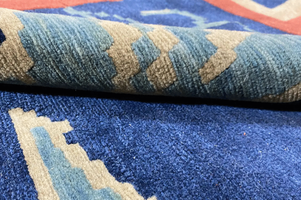 Bo Hamsa rug 304x253 cm, close-up of the pile: blue with beige and red accents