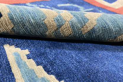 Bo Hamsa rug 304x253 cm, close-up of the pile: blue with beige and red accents