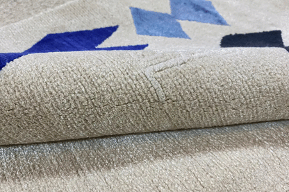 Close-up: beige carpet surface with a woven texture