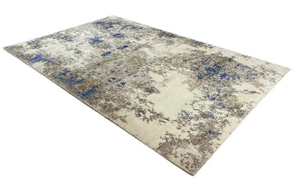 Beige rug with blue-accented abstract color fields