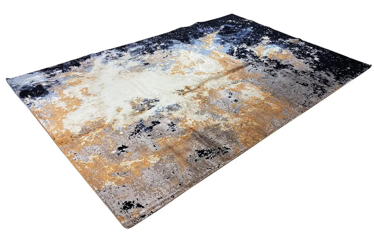 Rug with an abstract pattern in dark blue, beige, gray, and orange