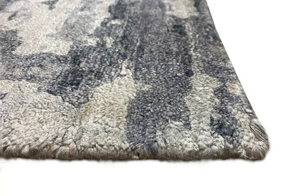 Designer rug corner view with a vintage color gradient in gray, beige, and light blue
