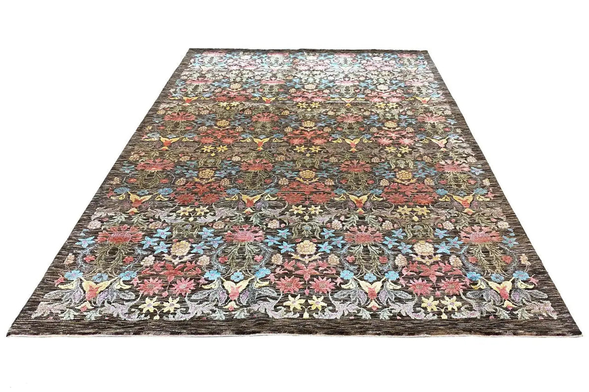 Rectangular rug with a dense floral and bird pattern, multicolored border