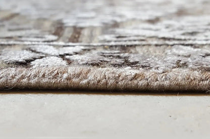 Carpet edge with low pile and a light-colored backing, textured border