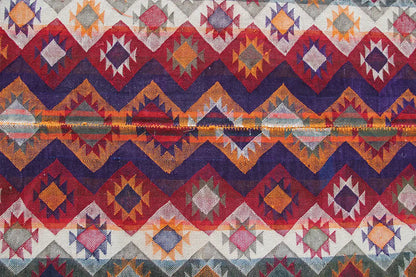 Full-surface pattern: many diamonds and zigzag lines in red, blue, orange, and gray