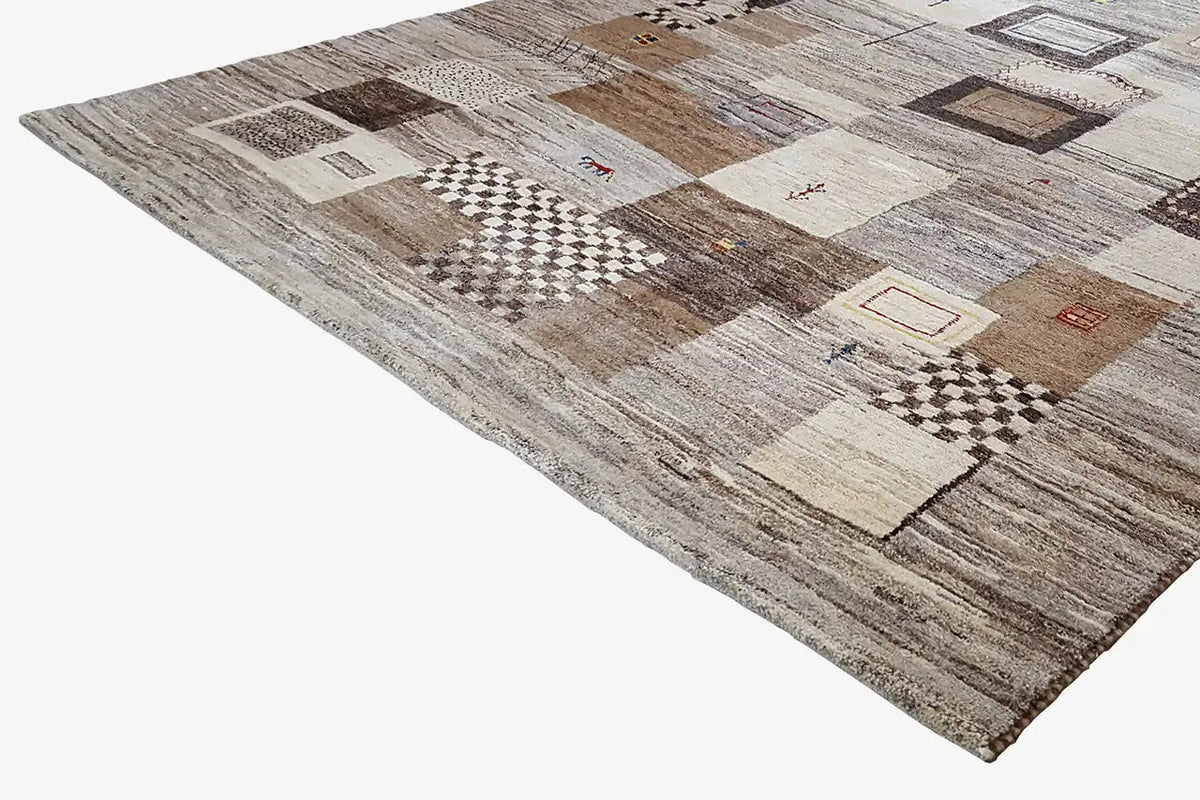 Gabbeh rug, angled view, patchwork design with light and dark squares