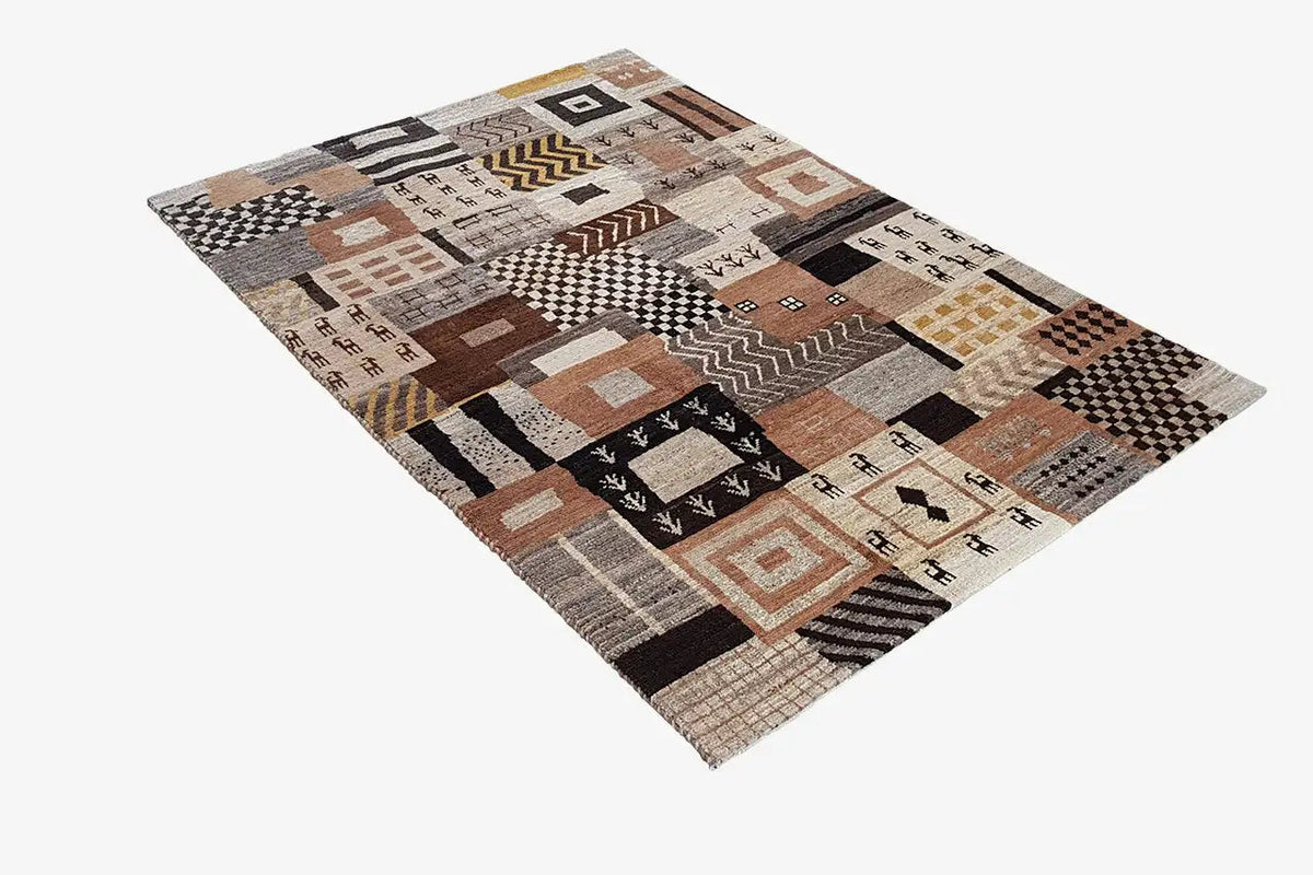 Rug with diagonal geometric patchwork in beige, brown, and black tones