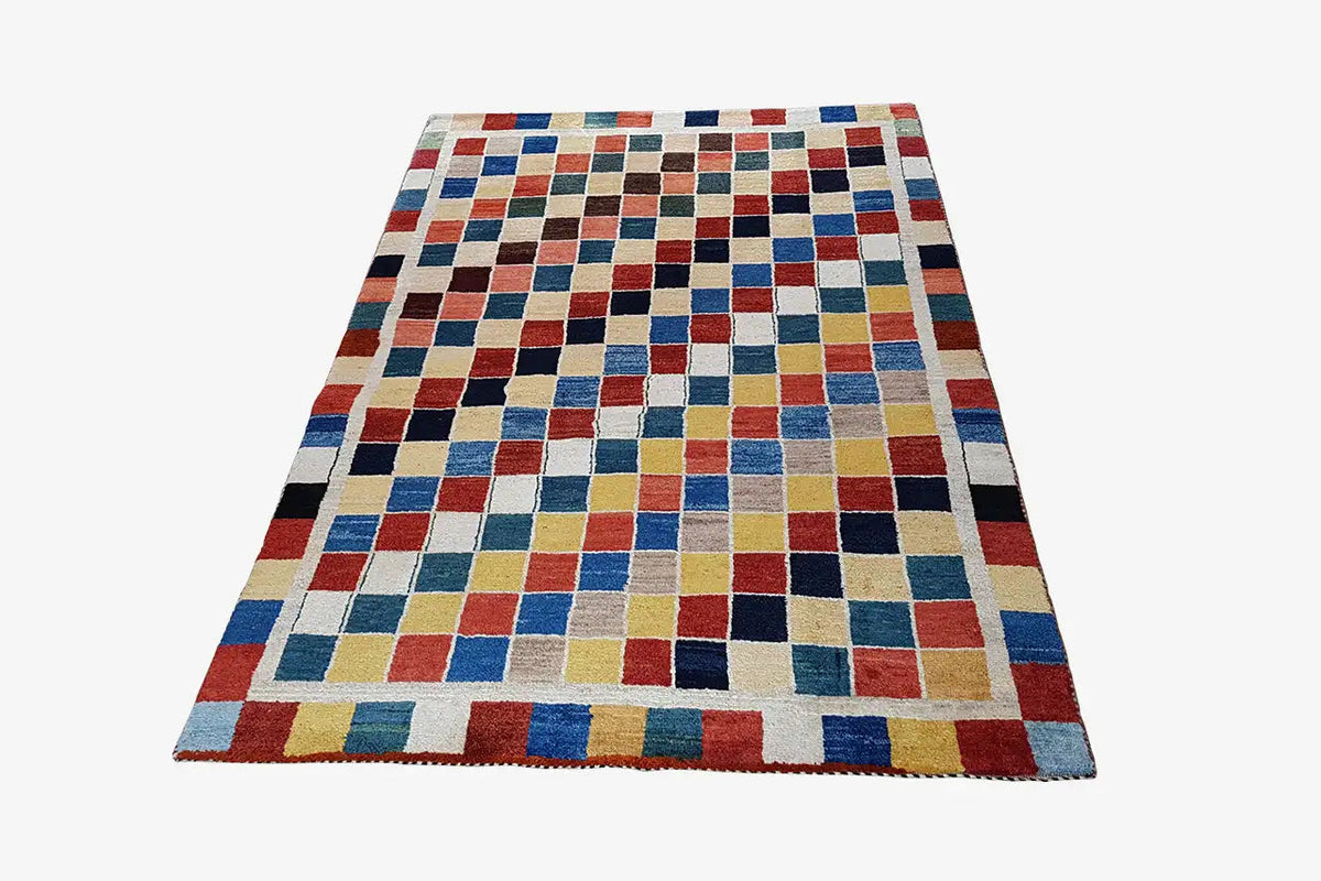 Rectangular Gabbeh rug (196x132 cm) with a colorful checkered and striped pattern, with fringes