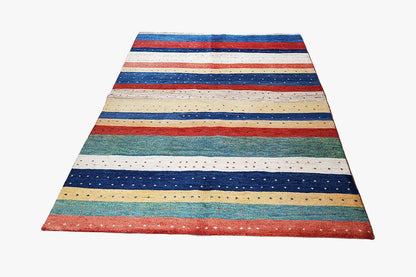 Gabbeh rug with horizontal stripes in blue, red, beige, and green, rectangular.