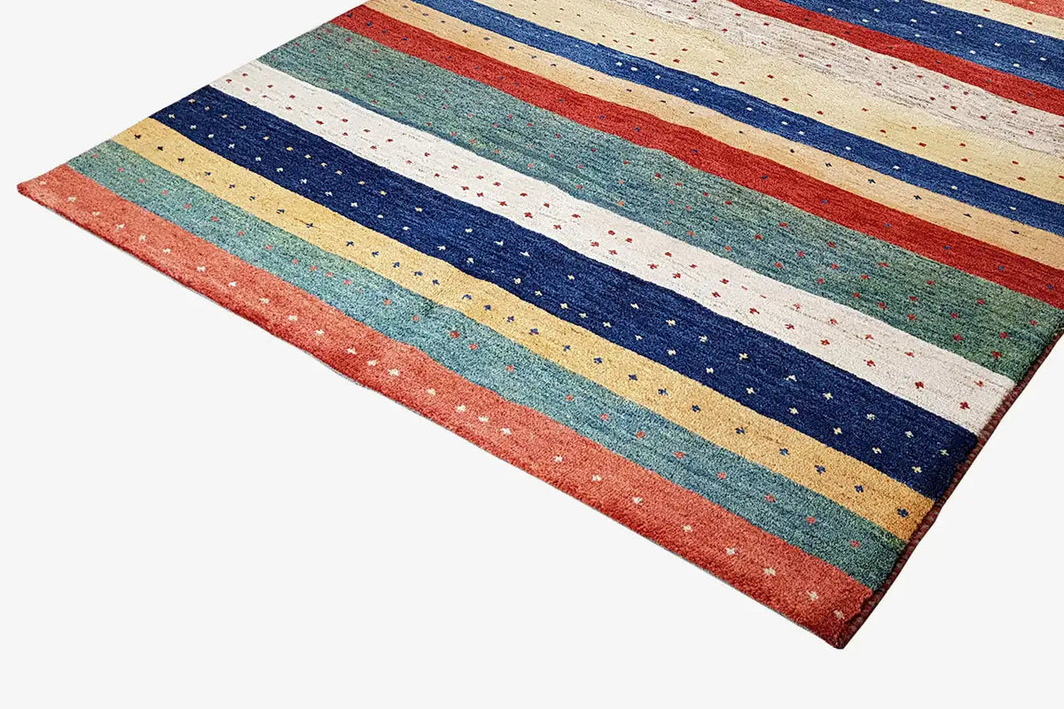Gabbeh rug with wide stripes in blue, red, beige, and green, rectangular, edged.