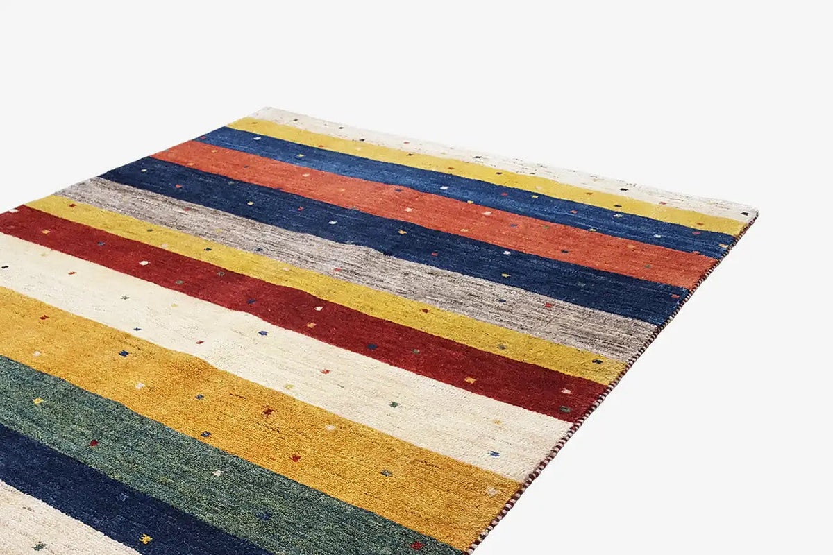 Gabbeh rug 193x143 cm: close-up of the stripes in blue, red, yellow and gray