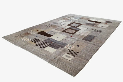 Gabbeh rug with geometric patchwork in gray, beige, and brown