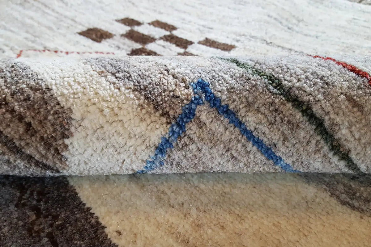 Close-up of a Gabbeh rug: pile surface with contrasting colors and short selvages