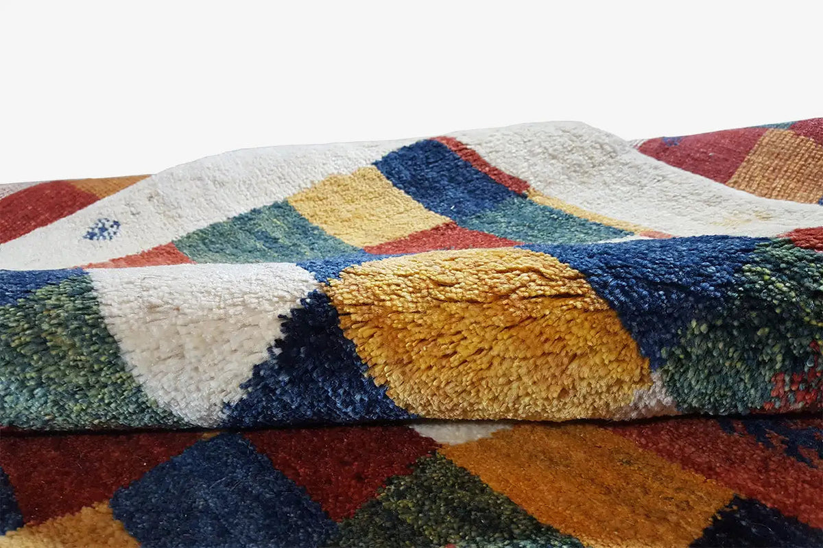 Gabbeh rug 203x147 cm, detail of the pile texture with colored patterned areas