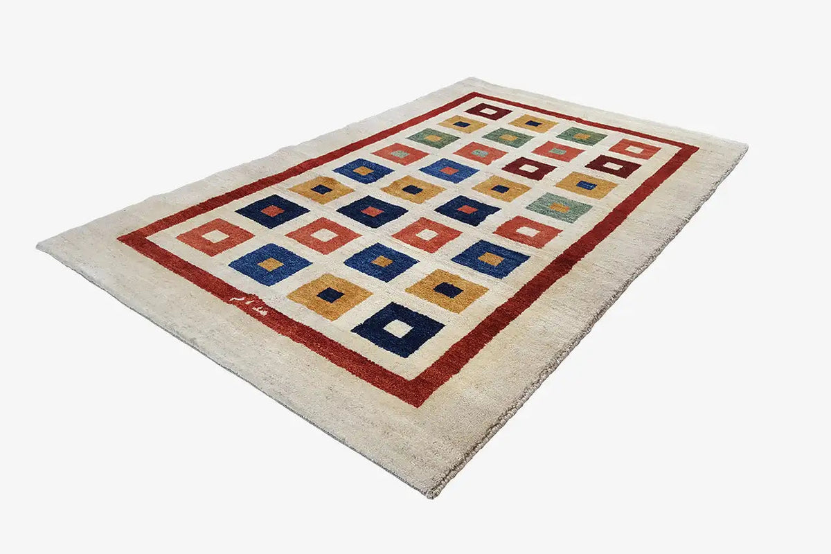 Gabbeh rug (203x129 cm) with a geometric square pattern in blue, red, and beige
