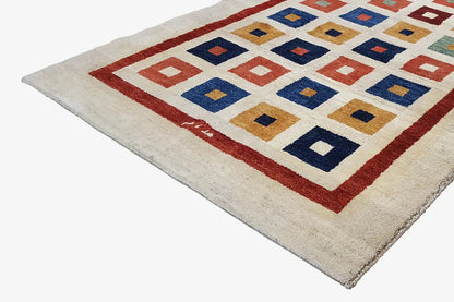 Gabbeh rug (203x129 cm) detail view: red border and multicolored diamond squares