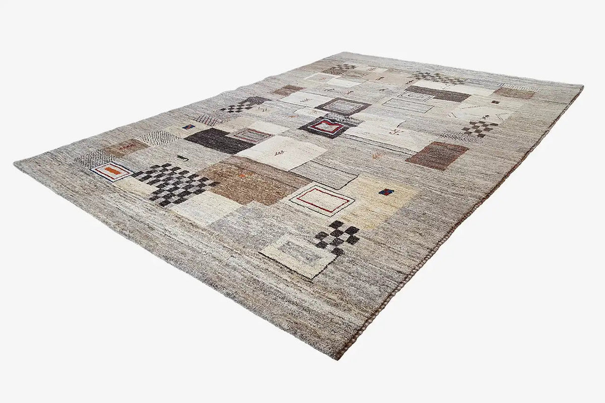 Gabbeh rug with square patterns in brown and black on a beige background