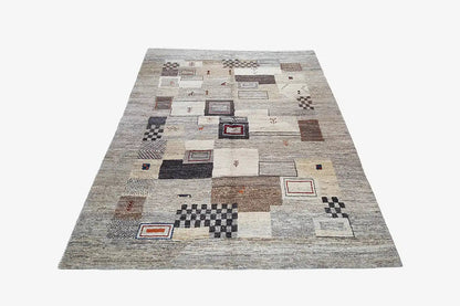 Beige gabbeh rug with geometric squares and colored borders