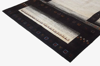 Gabbeh rug (303x201 cm) – diagonal view with a beige central band and dark decorative border