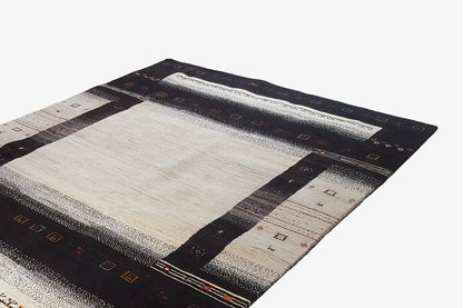 Gabbeh rug (303x201 cm) in black-brown with a beige square and block-pattern border