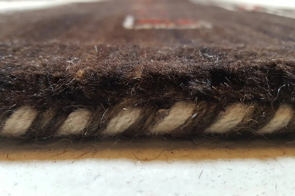 Gabbeh rug (303x201 cm) close-up of the rug edge with short fringes