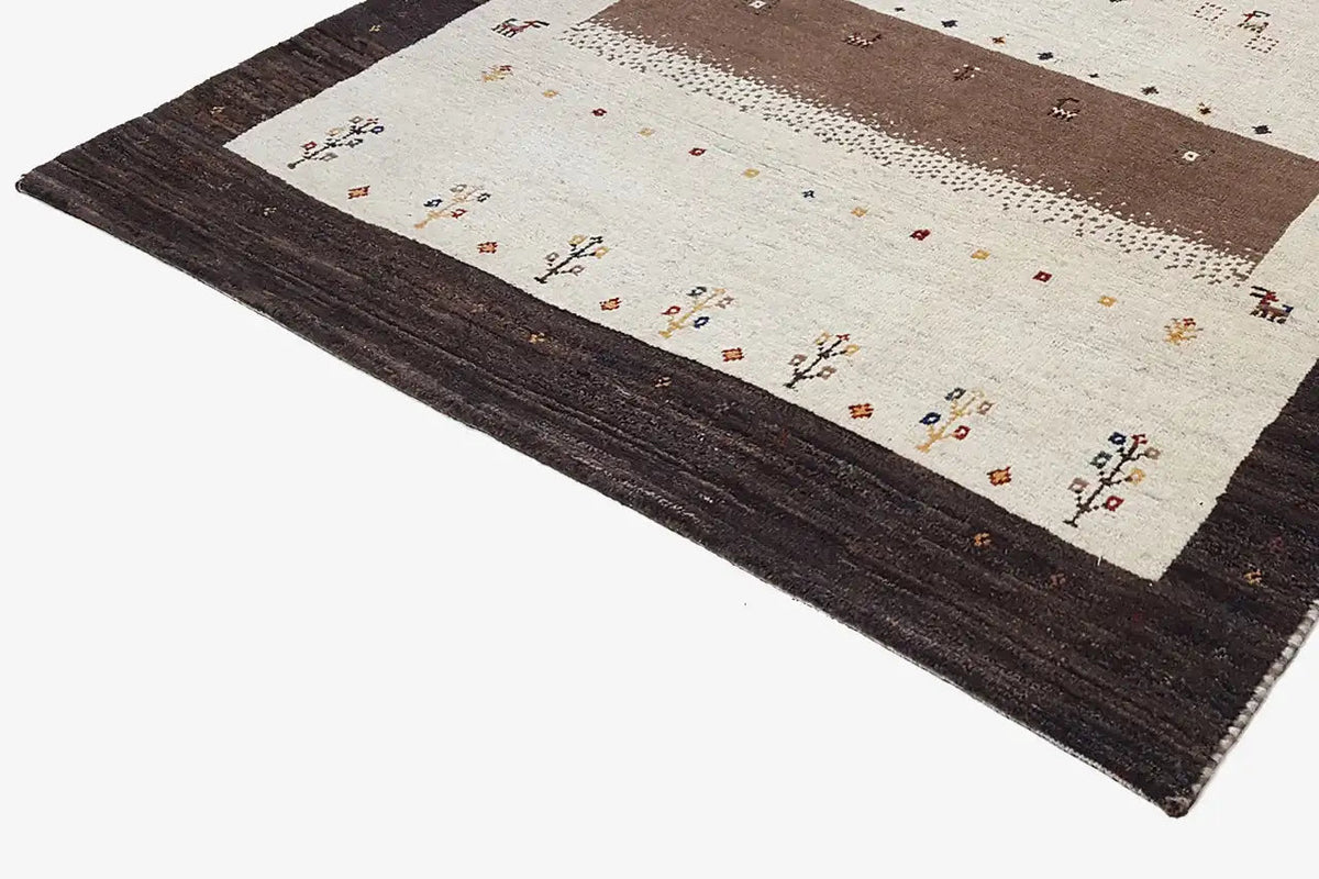 Gabbeh rug 175×117 cm, side view: cream background, brown stripes and tiny patterns