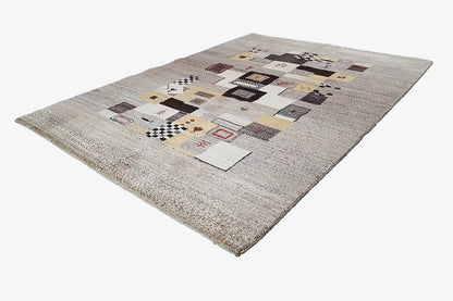Gabbeh rug 208x152 cm with geometric patchwork in gray, beige, and multicolored accents